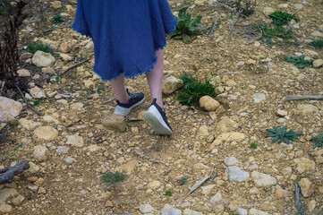 female walking down a mountain