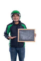 uber driver or commercial motorbike taxi rider holding blank board and smiling