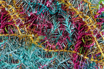 A lot of Christmas colorful vintage tinsel. Color festive Christmas background