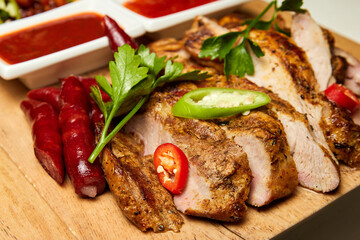 Chopped Pieces of Baked pork with tomato sauce