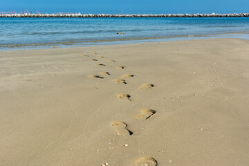 Foot prints  towards to sea at the beach in corniche park, Dammam, Saudi Arabia