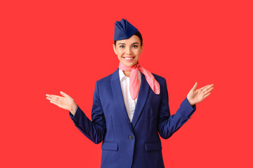 Beautiful stewardess on color background