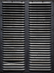 Rusty metal grilles, painted with paint and peeled off from old age, ventilation holes for air ingress in industrial facilities, an electric shield, an opening door