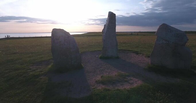 Ancient Stone Ales Stenar In The Summer Evening in South Sweden K&aring;seberga &Ouml;sterlen, Reverse Smooth Low Drone Shot