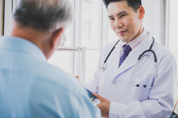 Medical professionals doctor are explaining health treatment information to elderly male patients.