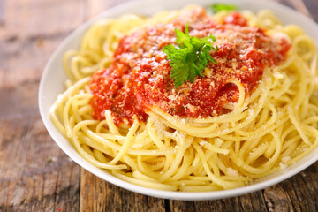 spaghetti with tomato sauce and parmesan