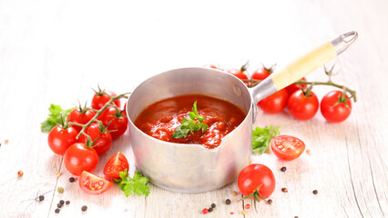 tomato sauce with fresh herbs and tomatoes in casserole