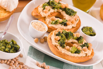 Friselle with turnip tops and hummus.