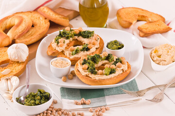 Friselle with turnip tops and hummus.