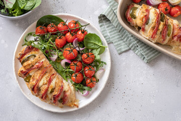 Baked hasselback chicken breast stuffed with bacon, cheese and jalapenos