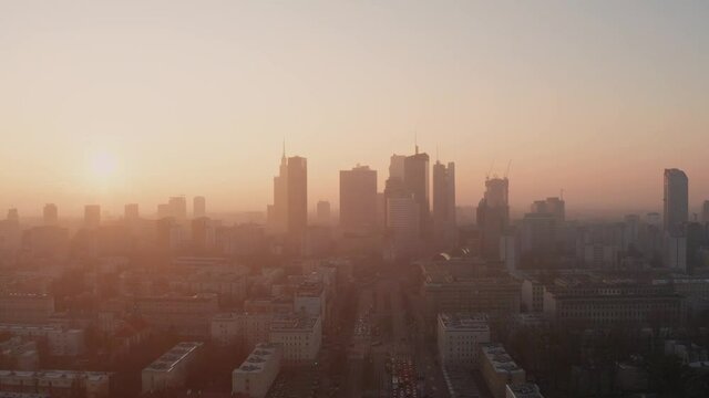 Morning flight over Warsaw. Sunrise and fog.