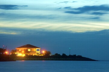 bunglow house during sunset standing on the manmade island in Port Dickson Malaysia
