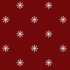 White snowflakes over red
 backdrop. Pattern made with white snowflakes. Holidays, winter concept.