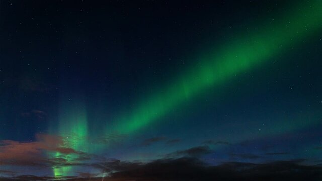 Aurora Borealis (Northern Lights) Timelapse In The Sky In Iceland - low angle shot