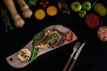 Delicious grilled meat in the plate with dark background