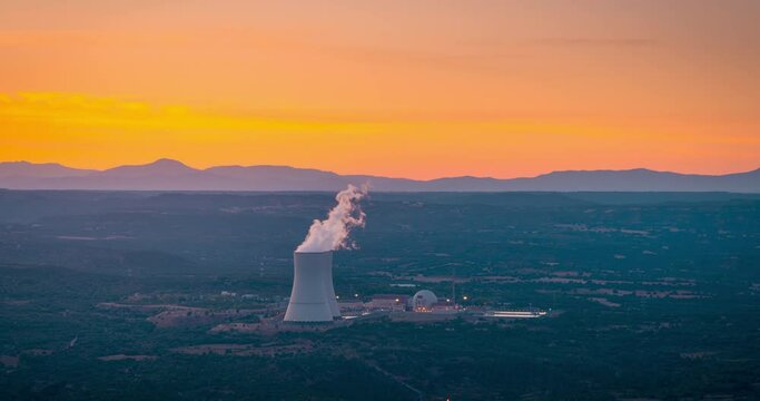 Smoke from chimneys at a thermal power station. Nuclear power plant in Guadalajara, Spain. Timelapse during sunset.