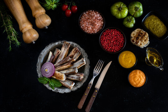 Delicious grilled meat in the plate with dark background