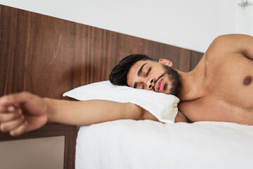 Obraz na płótnie Canvas latin american man waking up in the morning