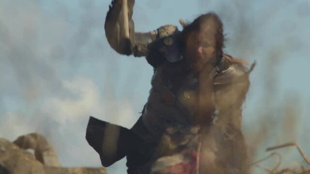Female knight fighting and killing medieval warrior, emotions in her face, wide angle view