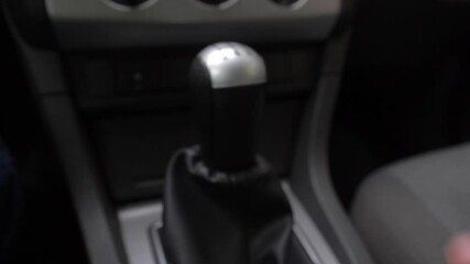 Driver Changing Gears with Manual Transmission Gear Stick