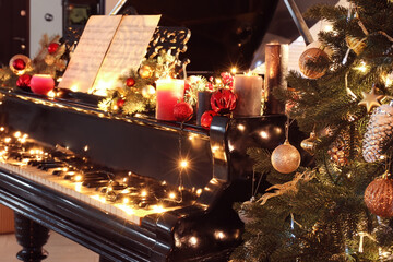 Grand piano decorated for Christmas in room