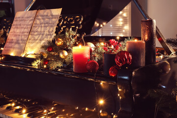 Grand piano decorated for Christmas in room