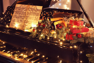 Grand piano decorated for Christmas in room