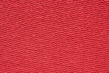 Red fabric texture background close up