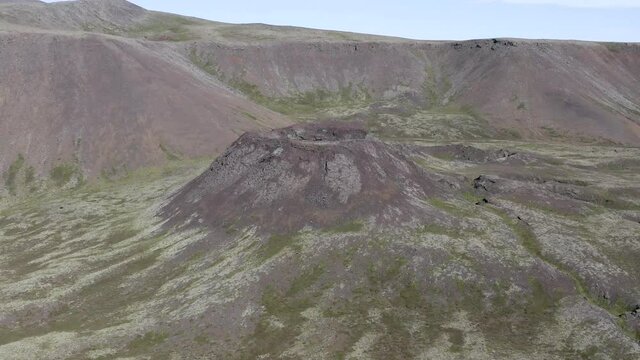Natural landmark volcanic cone crater in wild landscape of Iceland