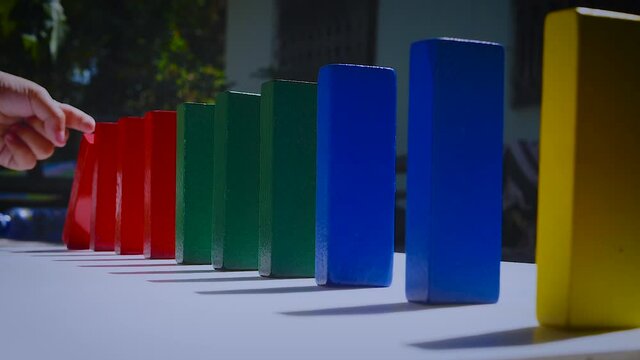 Falling domino color block slow motion. Falling and collapse concept