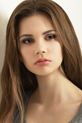 Obraz premium Beauty face makeup. Make up. Perfect Make-up closeup. Foundation. Cosmetic Eyeshadow, eyebrow. Beauty Girl with Perfect Skin. Makeover