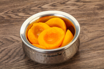 Marinated peaches fruit in the bowl