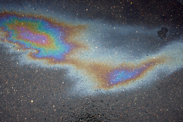 Beautiful abstract colorful background, texture:, stains from engine oil on the asphalt