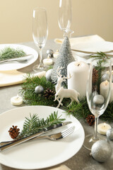Concept of romantic New year table setting on gray table