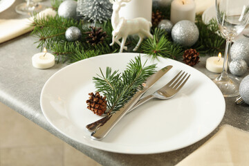 Concept of romantic New year table setting on gray table