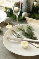 Concept of romantic New year table setting on gray table