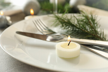 Concept of romantic New year table setting on gray table