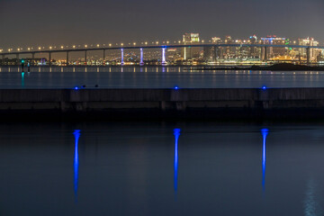 Fototapeta na wymiar San Diego-Coronado Bay Bridge at night during a testing of multicolor lights.