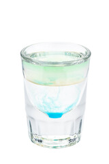 Alcohol shots cocktail in a glass isolated on white background. Layered composed of green, white and blue liqueur