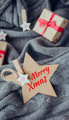 Merry Christmas card, gift boxes and decorations on cozy gray background. - 393507552