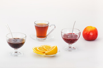 A warm tea with a fragrant lemon and raspberry jam