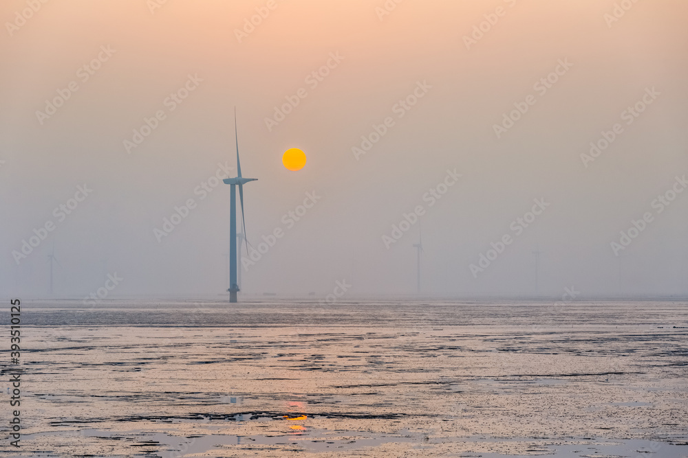 Canvas Prints wind farm on mud flats in sunrise