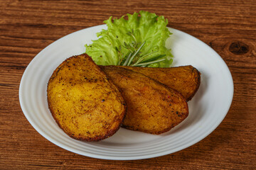 Baked potato with herbs and spices