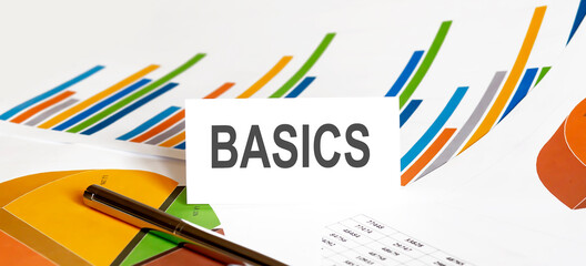 BASICS text on paper on chart background with pen