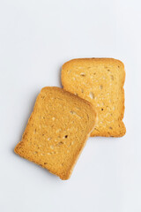 Dry sliced bread on white