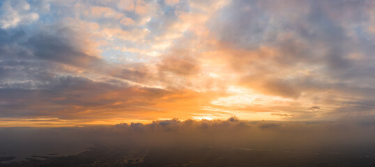 Naklejka na ściany i meble Bright and intense Panorama twilight cloudy sky. Evening background image