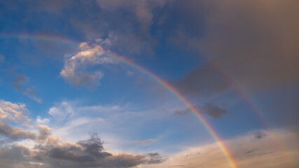 Fototapeta na wymiar Beautiful rainbow and blues sky background