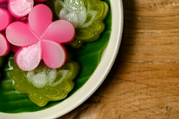 Layered candy Thai dessert rose shape on wooden table