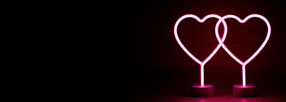 Two Glowing Pink Neon Hearts