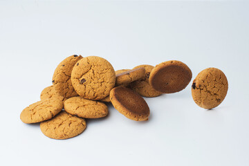 Butter cookies with black raisins on white